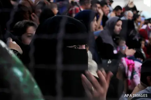 Palestinians wait for travel permits to cross into Egypt through the Rafah border crossing after it was opened for four days by Egyptian authorities, in the southern Gaza Strip June 1, 2016. Photo by Abed Rahim Khatib