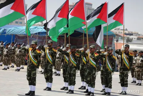 Member of Palestinian security forces display their skills during a military graduation ceremony in Gaza City June 2, 2016. Photo by Mohammed Asad