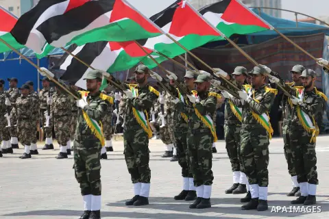 Member of Palestinian security forces display their skills during a military graduation ceremony in Gaza City June 2, 2016. Photo by Mohammed Asad