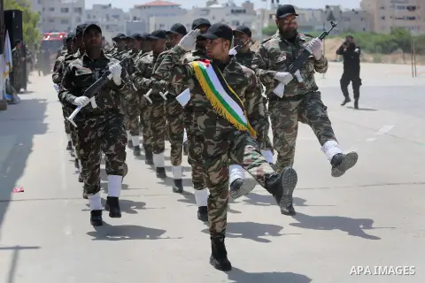 Member of Palestinian security forces display their skills during a military graduation ceremony in Gaza City June 2, 2016. Photo by Mohammed Asad