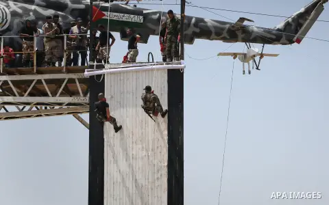 Member of Palestinian security forces display their skills during a military graduation ceremony in Gaza City June 2, 2016. Photo by Mohammed Asad