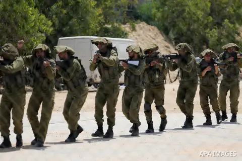 Member of Palestinian security forces display their skills during a military graduation ceremony in Gaza City June 2, 2016. Photo by Mohammed Asad
