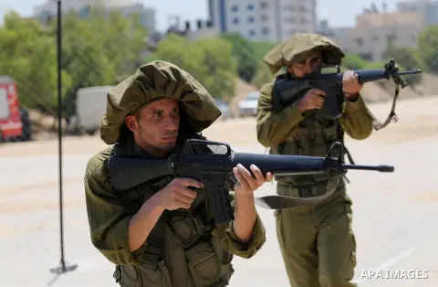 Member of Palestinian security forces display their skills during a military graduation ceremony in Gaza City June 2, 2016. Photo by Mohammed Asad