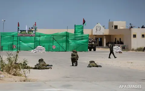 Member of Palestinian security forces display their skills during a military graduation ceremony in Gaza City June 2, 2016. Photo by Mohammed Asad
