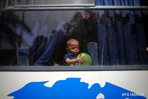 Palestinians wait for travel permits to cross into Egypt through the Rafah border crossing after it was opened for four days by Egyptian authorities, in the southern Gaza Strip June 02, 2016. Photo by Mohammed Dahman
