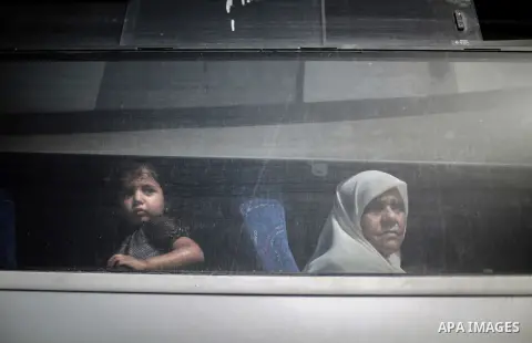 Palestinians wait for travel permits to cross into Egypt through the Rafah border crossing after it was opened for four days by Egyptian authorities, in the southern Gaza Strip June 02, 2016. Photo by Mohammed Dahman