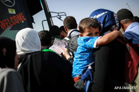 Palestinians wait for travel permits to cross into Egypt through the Rafah border crossing after it was opened for four days by Egyptian authorities, in the southern Gaza Strip June 02, 2016. Photo by Mohammed Dahman