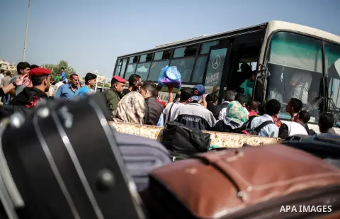 Palestinians wait for travel permits to cross into Egypt through the Rafah border crossing after it was opened for four days by Egyptian authorities, in the southern Gaza Strip June 02, 2016. Photo by Mohammed Dahman