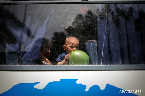 Palestinians wait for travel permits to cross into Egypt through the Rafah border crossing after it was opened for four days by Egyptian authorities, in the southern Gaza Strip June 02, 2016. Photo by Mohammed Dahman