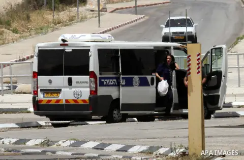 Prominent Palestinian lawmaker Khalida Jarrar walks through the Jubara checkpoint near the northern West Bank city of Tulkarem, following her release from an Israeli jail on June 3, 2016, after serving a 15-month sentenc...