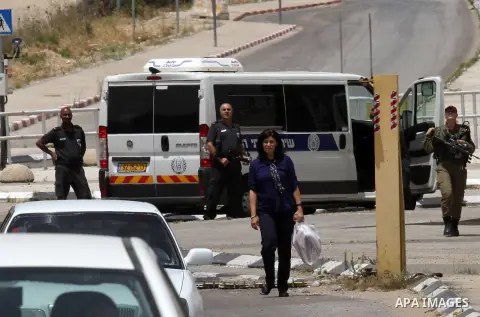 Prominent Palestinian lawmaker Khalida Jarrar walks through the Jubara checkpoint near the northern West Bank city of Tulkarem, following her release from an Israeli jail on June 3, 2016, after serving a 15-month sentenc...