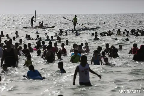 Palestininas swim in the Mediterranean sea on the coast of Gaza city, on June 03, 2016 on the last Friday before the Islamic holy month of Ramadan. Photo by Mohammed Asad