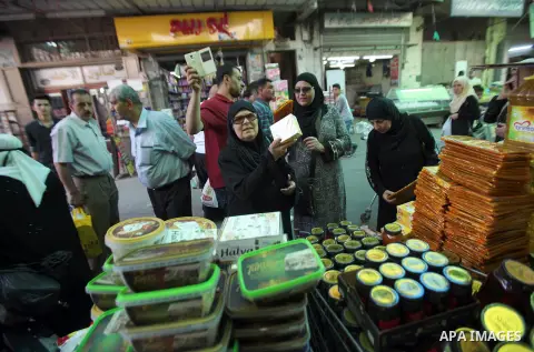 Palestinians shop at a traditional market in preparation for the holy month of Ramadan in the west bank city of Nablus on June 4,2016. Muslims around the world refrain from eating, drinking and sexual intercourse from da...