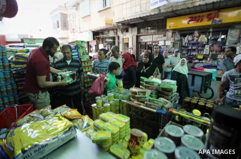 Palestinians shop at a traditional market in preparation for the holy month of Ramadan in the west bank city of Nablus on June 4,2016. Muslims around the world refrain from eating, drinking and sexual intercourse from da...