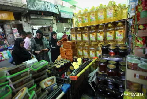 Palestinians shop at a traditional market in preparation for the holy month of Ramadan in the west bank city of Nablus on June 4,2016. Muslims around the world refrain from eating, drinking and sexual intercourse from da...