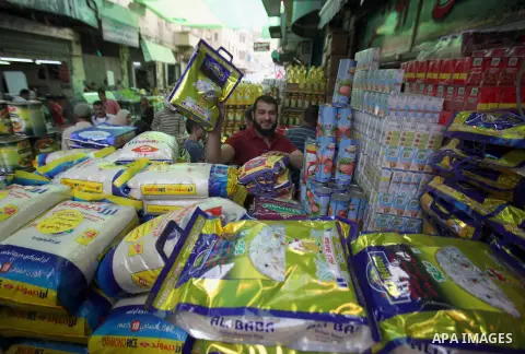 Palestinians shop at a traditional market in preparation for the holy month of Ramadan in the west bank city of Nablus on June 4,2016. Muslims around the world refrain from eating, drinking and sexual intercourse from da...