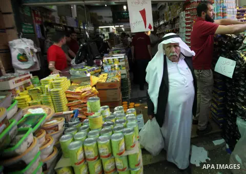 Palestinians shop at a traditional market in preparation for the holy month of Ramadan in the west bank city of Nablus on June 4,2016. Muslims around the world refrain from eating, drinking and sexual intercourse from da...