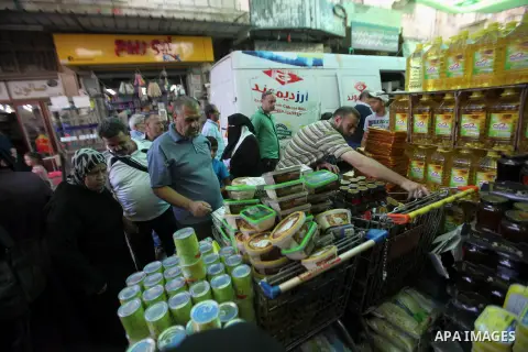 Palestinians shop at a traditional market in preparation for the holy month of Ramadan in the west bank city of Nablus on June 4,2016. Muslims around the world refrain from eating, drinking and sexual intercourse from da...