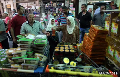 Palestinians shop at a traditional market in preparation for the holy month of Ramadan in the west bank city of Nablus on June 4,2016. Muslims around the world refrain from eating, drinking and sexual intercourse from da...