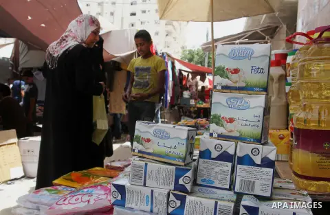 Palestinians shop at a traditional market in preparation for the holy month of Ramadan in Rafah in the southern Gaza strip on June 4,2016. Muslims around the world refrain from eating, drinking and sexual intercourse fro...