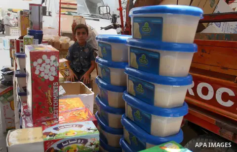 Palestinians shop at a traditional market in preparation for the holy month of Ramadan in Rafah in the southern Gaza strip on June 4,2016. Muslims around the world refrain from eating, drinking and sexual intercourse fro...