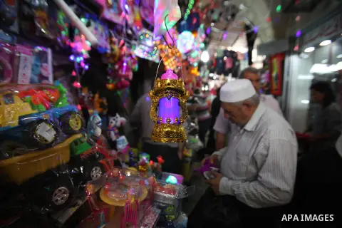 A Palestinian vendor displays traditional lanterns known in Arabic as "Fanous" sold during the Muslim holy month of Ramadan at a market in the west bank city of Nablus , on June 5, 2016 as the faithful prepare to start f...