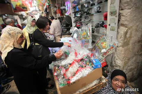 A Palestinian vendor displays traditional lanterns known in Arabic as "Fanous" sold during the Muslim holy month of Ramadan at a market in the west bank city of Nablus , on June 5, 2016 as the faithful prepare to start f...