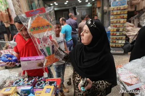 A Palestinian vendor displays traditional lanterns known in Arabic as "Fanous" sold during the Muslim holy month of Ramadan at a market in the west bank city of Nablus , on June 5, 2016 as the faithful prepare to start f...