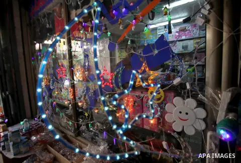 A Palestinian vendor displays traditional lanterns known in Arabic as "Fanous" sold during the Muslim holy month of Ramadan at a market in the west bank city of Nablus , on June 5, 2016 as the faithful prepare to start f...