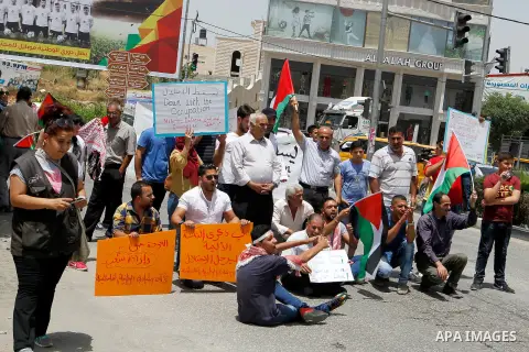 Palestinians take part in a demonstration to mark Naksa Day (setback), in the West Bank city of Hebron, on June 04, 2016. Palestinians mark "Naksa Day" to mourn the 49th anniversary of Israel's occupation of the West Ban...