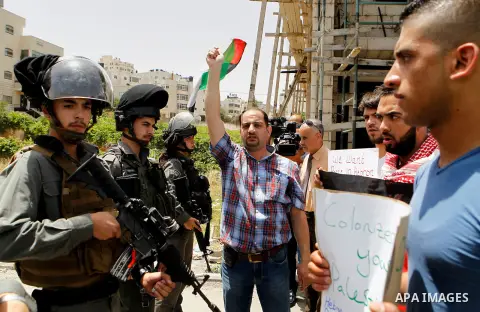 Palestinians take part in a demonstration to mark Naksa Day (setback), in the West Bank city of Hebron, on June 04, 2016. Palestinians mark "Naksa Day" to mourn the 49th anniversary of Israel's occupation of the West Ban...