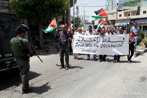 Palestinians take part in a demonstration to mark Naksa Day (setback), in the West Bank city of Hebron, on June 04, 2016. Palestinians mark "Naksa Day" to mourn the 49th anniversary of Israel's occupation of the West Ban...
