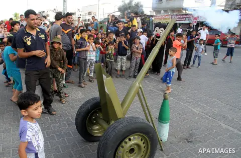 Palestinian children take part in a street celebration ahead of the beginning of the Muslim holy month of Ramadan in Rafah in the southern Gaza strip on June 5, 2016. More than 1.5 billion Muslims around the world will s...
