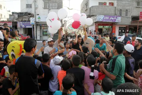 Palestinian children take part in a street celebration ahead of the beginning of the Muslim holy month of Ramadan in Rafah in the southern Gaza strip on June 5, 2016. More than 1.5 billion Muslims around the world will s...