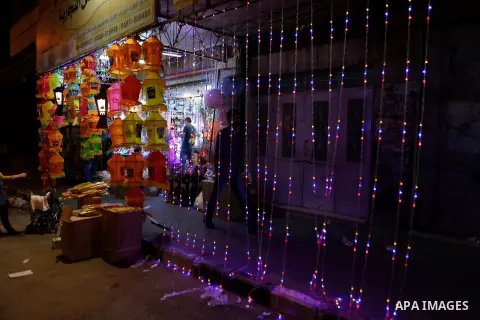 A Palestinian vendor displays traditional lanterns known in Arabic as "Fanous" sold during the Muslim holy month of Ramadan at a market in the West bank city of Hebron, on June 05, 2016. More than 1.5 billion Muslims aro...