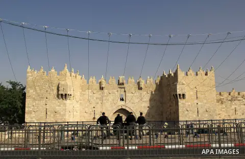 Israeli security forces stand guard during an annual march marking Israel's 1967 seizure of the Palestinian-dominated eastern half of Jerusalem, outside Damascus Gate in Jerusalem's old city on June 5, 2016. Israel occup...