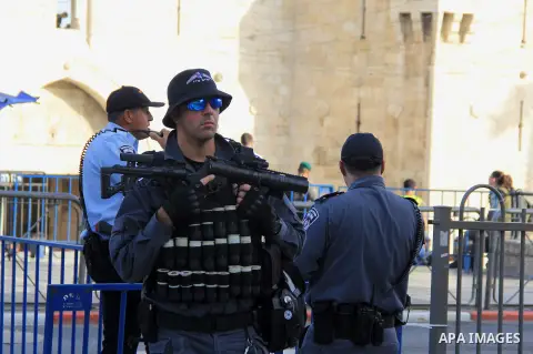 Israeli security forces stand guard during an annual march marking Israel's 1967 seizure of the Palestinian-dominated eastern half of Jerusalem, outside Damascus Gate in Jerusalem's old city on June 5, 2016. Israel occup...