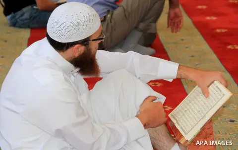 Palestinians Muslims read holy Koran, Islam's holy book at al-Aqsa mosque, in Jerusalem's old city on June 6, 2016 on the first day of the Ramadan,. More than 1.5 billion Muslims around the world will start to celebrate...