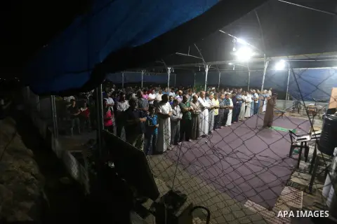 Palestinian Muslim worshipers perform "Taraweeh", nightly prayer of the month of Ramadan, at al-Muntar mosque which was destroyed during the 50-day war between Israel and Hamas militants in the summer of 2014, in Shajaiy...