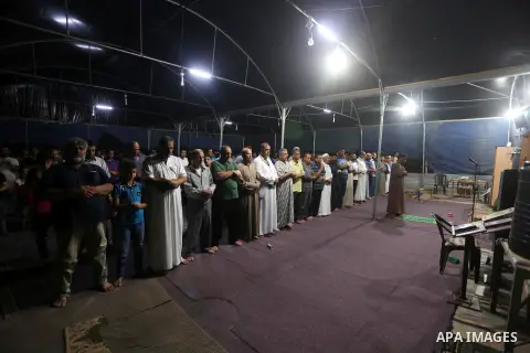 Palestinian Muslim worshipers perform "Taraweeh", nightly prayer of the month of Ramadan, at al-Muntar mosque which was destroyed during the 50-day war between Israel and Hamas militants in the summer of 2014, in Shajaiy...