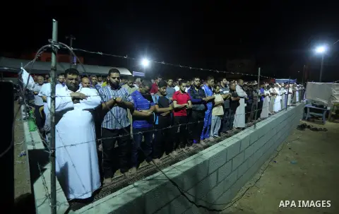 Palestinian Muslim worshipers perform "Taraweeh", nightly prayer of the month of Ramadan, at al-Tawfeq mosque which was destroyed during the 50-day war between Israel and Hamas militants in the summer of 2014, in Shajaiy...