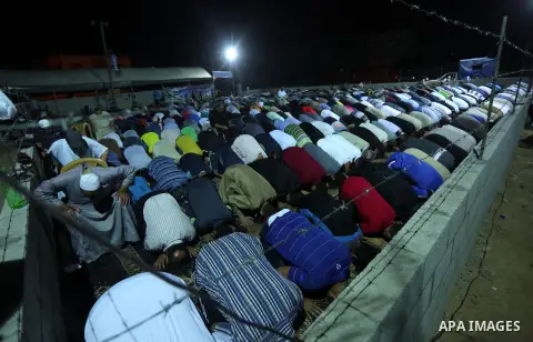 Palestinian Muslim worshipers perform "Taraweeh", nightly prayer of the month of Ramadan, at al-Tawfeq mosque which was destroyed during the 50-day war between Israel and Hamas militants in the summer of 2014, in Shajaiy...