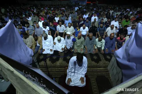 Palestinian Muslim worshipers perform "Taraweeh", nightly prayer of the month of Ramadan, at al-Tawfeq mosque which was destroyed during the 50-day war between Israel and Hamas militants in the summer of 2014, in Shajaiy...