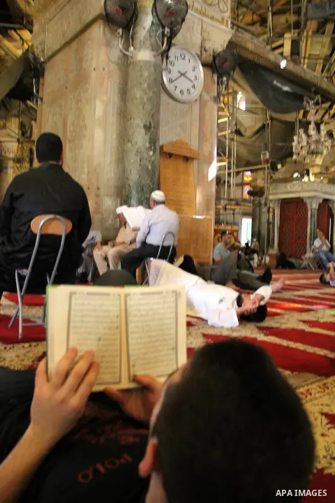 Palestinians Muslims read holy Koran, Islam's holy book, at al-Aqsa mosque, in Jerusalem's old city on June 7, 2016. Ramadan is sacred to Muslims because it is during that month that tradition says the Koran was revealed...