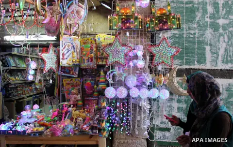 A Palestinian vendor displays traditional lanterns known in Arabic as "Fanous" at a market in Jerusalem's old city on June 7, 2016. Ramadan is sacred to Muslims because it is during that month that tradition says the Kor...
