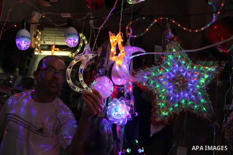 A Palestinian vendor displays traditional lanterns known in Arabic as "Fanous" at a market in Jerusalem's old city on June 7, 2016. Ramadan is sacred to Muslims because it is during that month that tradition says the Kor...