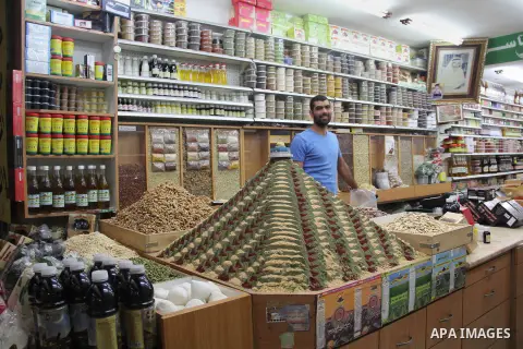 Palestinians shop at a market on the second day of the Ramadan in Jerusalem's old city on June 7, 2016. Ramadan is sacred to Muslims because it is during that month that tradition says the Koran was revealed to the Proph...