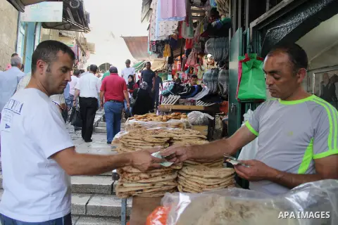 Palestinians shop at a market on the second day of the Ramadan in Jerusalem's old city on June 7, 2016. Ramadan is sacred to Muslims because it is during that month that tradition says the Koran was revealed to the Proph...