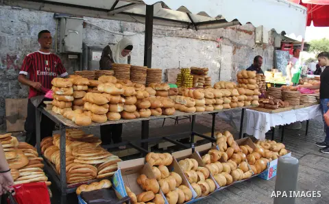 Palestinians shop at a market on the second day of the Ramadan in Jerusalem's old city on June 7, 2016. Ramadan is sacred to Muslims because it is during that month that tradition says the Koran was revealed to the Proph...