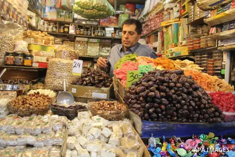 Palestinians shop at a market on the second day of the Ramadan in Jerusalem's old city on June 7, 2016. Ramadan is sacred to Muslims because it is during that month that tradition says the Koran was revealed to the Proph...